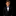 Young boy in a formal black suit with a bow tie on a black background