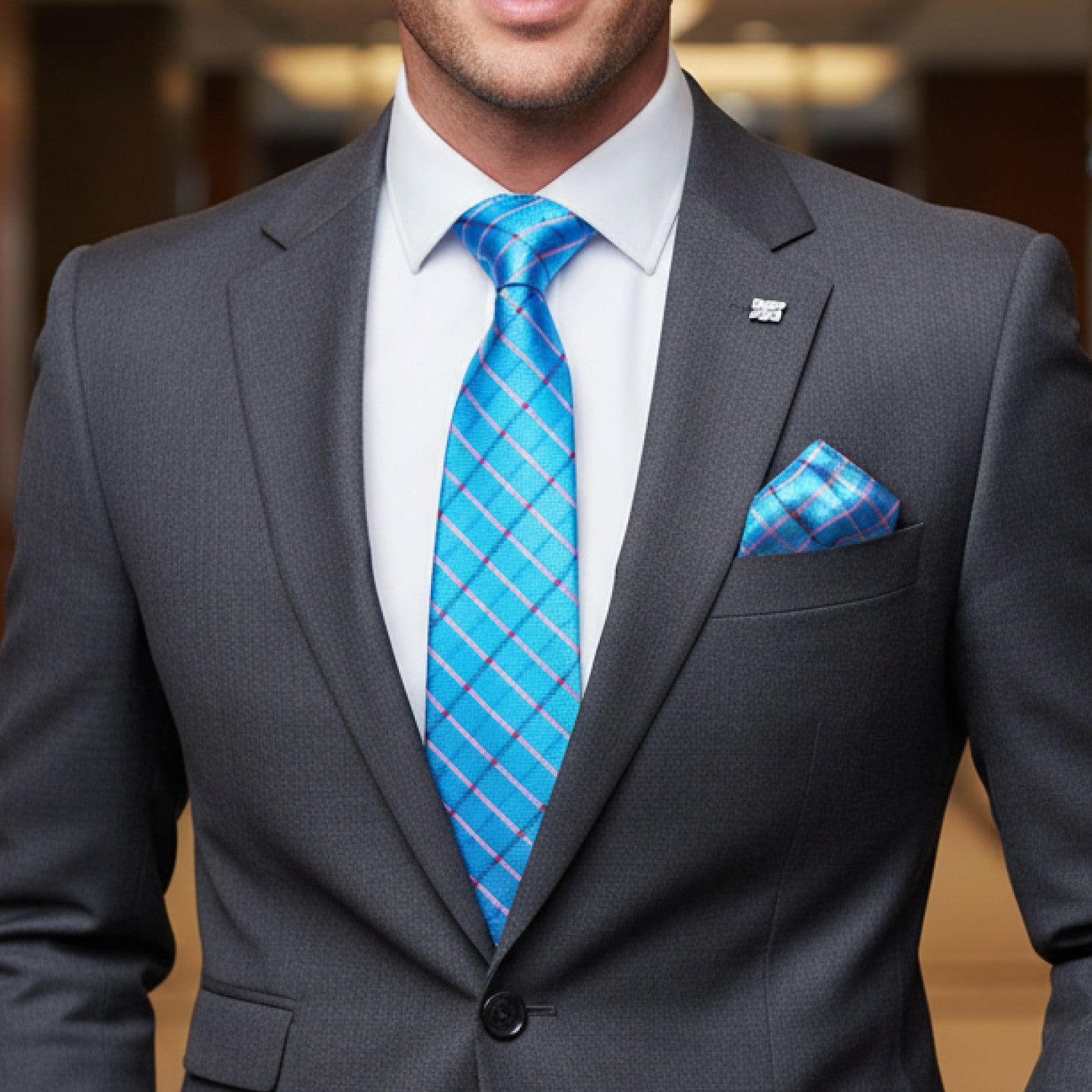 Light Blue Plaid Tie and Square On Man Wearing Suit