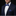 Man wearing a navy suit with a blue bow tie and pocket square on a black background
