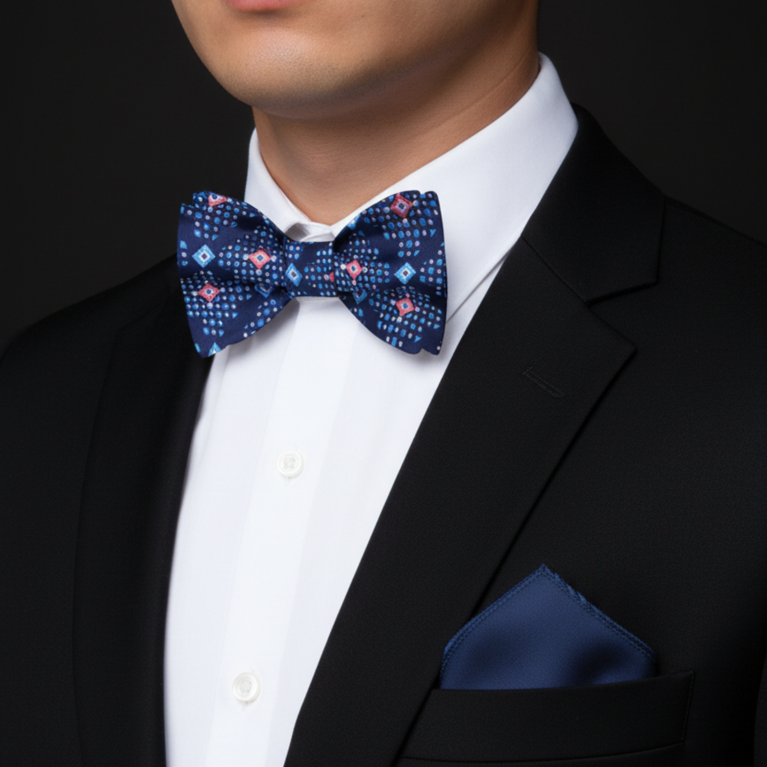 Man wearing Blue Geometric bow Tie and Accenting Blue Square