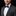 man wearing blue with gold stripe bow tie and accenting square