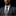 Man wearing a dark gray suit with a patterned tie and pocket square on a black background