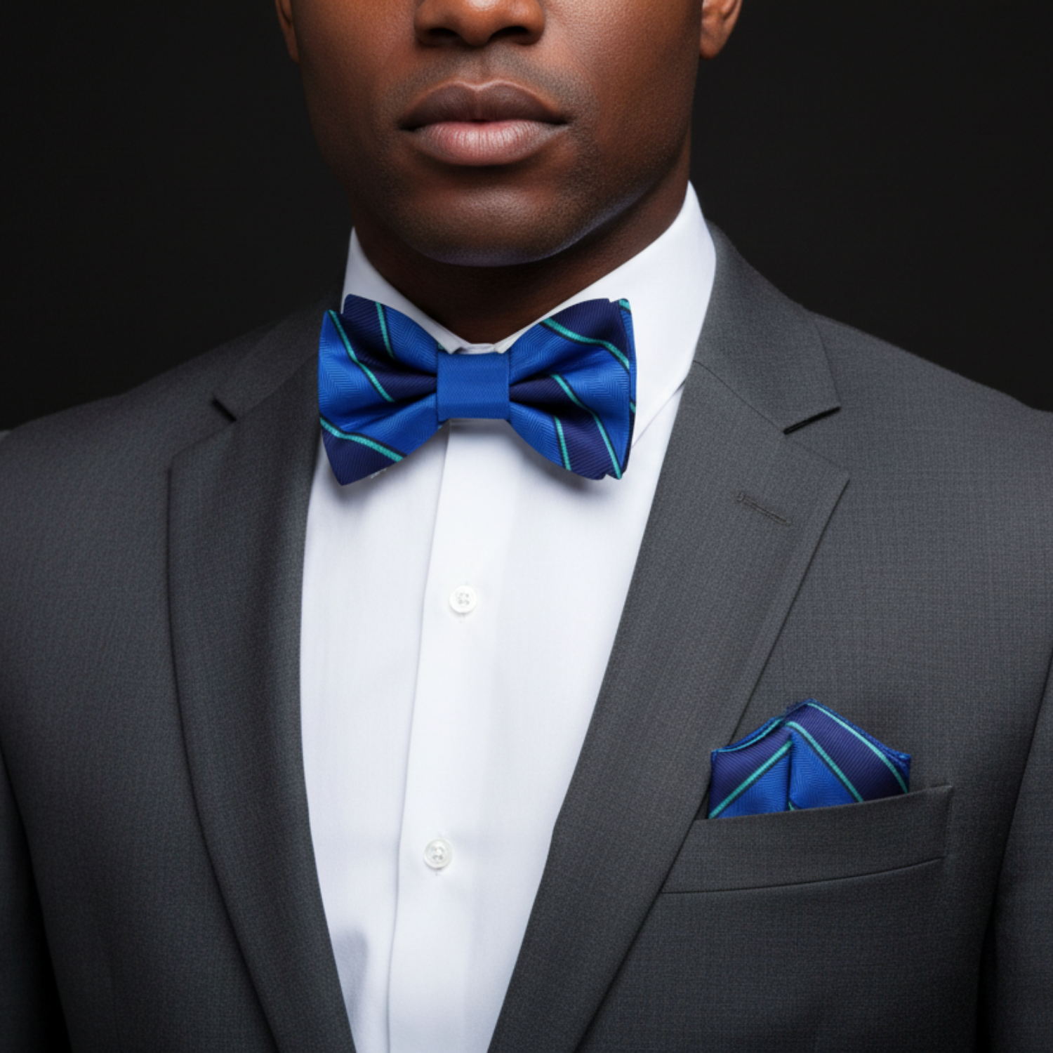 Man wearing blue stripe bow tie and square
