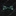 A dark blue silk bow tie with a green floral pattern laid out on a wooden surface.