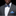 Man wearing grey, black and blue geometric squares bow tie and blue square