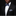 Man wearing a black suit with a white shirt, blue bow tie, and matching pocket square on a black background.