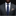 Man wearing a gray suit with a blue tie and patterned pocket square on a black background