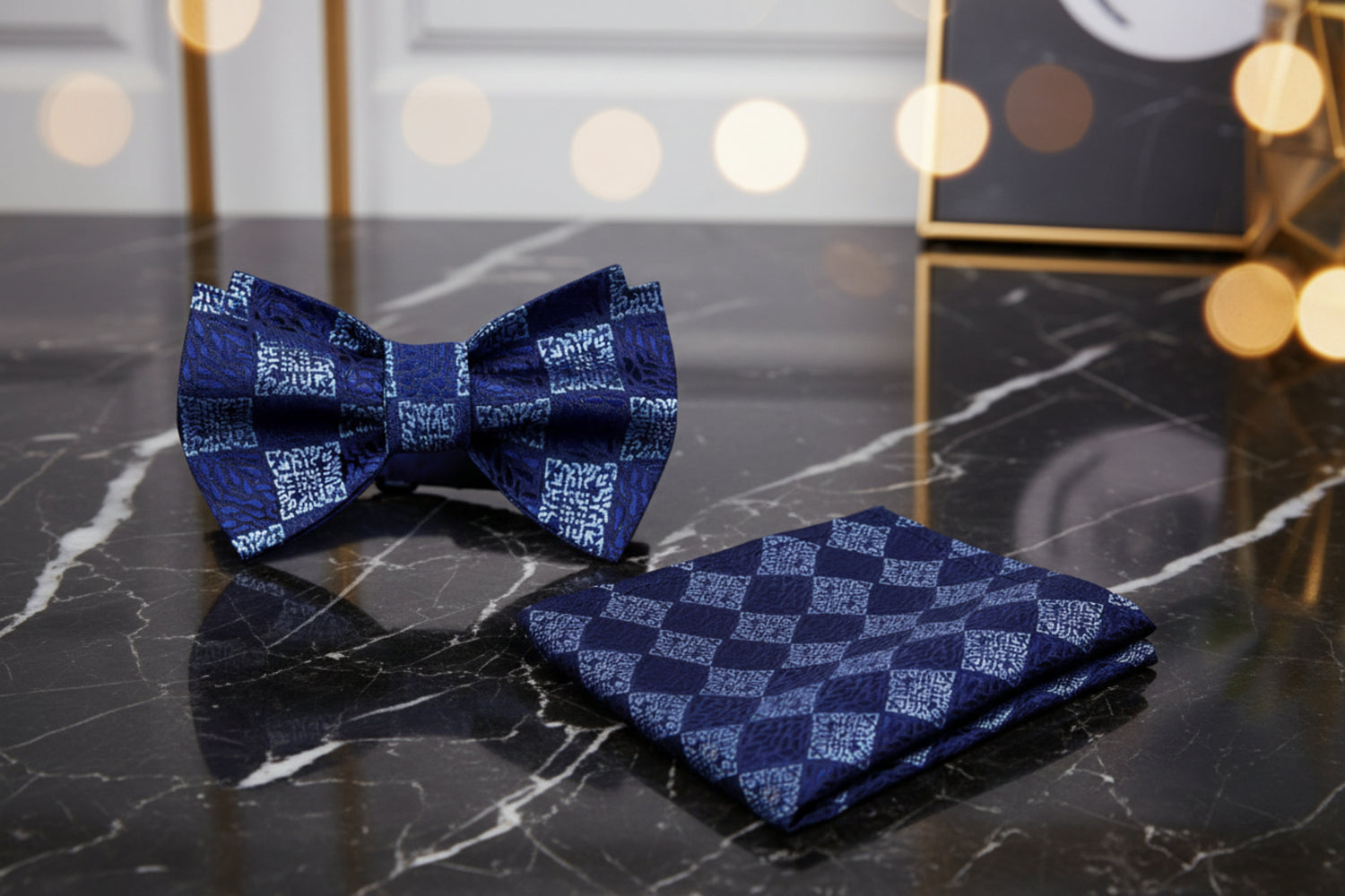 Navy blue bow tie and pocket square set with geometric pattern
