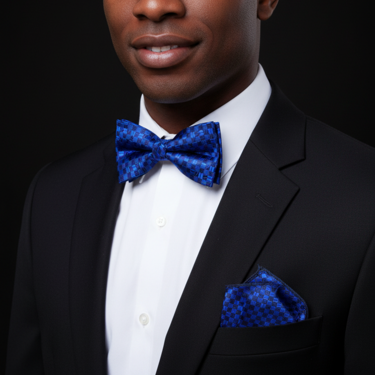 Man wearing blue geometric bow tie and square