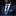 Man wearing a blue suit with a patterned tie and pocket square on a black background