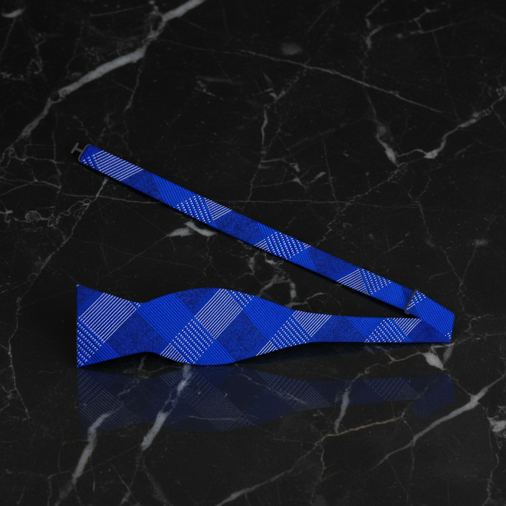 Blue bow tie on a black marble surface