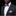 Man wearing a black suit with a colorful bow tie and purple pocket square on a black background