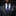 Man wearing a gray suit with a blue patterned tie and matching pocket square on a black background