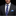 Blue and Purple plaid tie and light blue square on man with suit