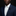 Man wearing a navy suit with a white shirt and a decorative lapel pin against a black background