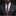 Man wearing a dark suit with a red and blue plaid tie and pocket square against a black background