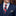 Man wearing a navy suit with an American flag tie and pocket square.