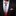 Man wearing a black suit with a red and blue striped tie and matching pocket square.