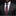 Man wearing a dark suit with a red and blue paisley tie and pocket square.