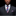 Man wearing a dark suit with a plaid tie and pocket square against a black background