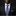 Man wearing a black suit with a blue paisley tie and matching pocket square.