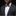 Man wearing a dark suit with a colorful bow tie and matching pocket square on a black background