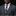 Man wearing a gray suit with a patterned tie and pocket square against a black background