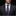 Man wearing a dark suit with a patterned tie and pocket square against a black background