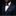 Man wearing a navy suit with a patterned bow tie and pocket square on a black background