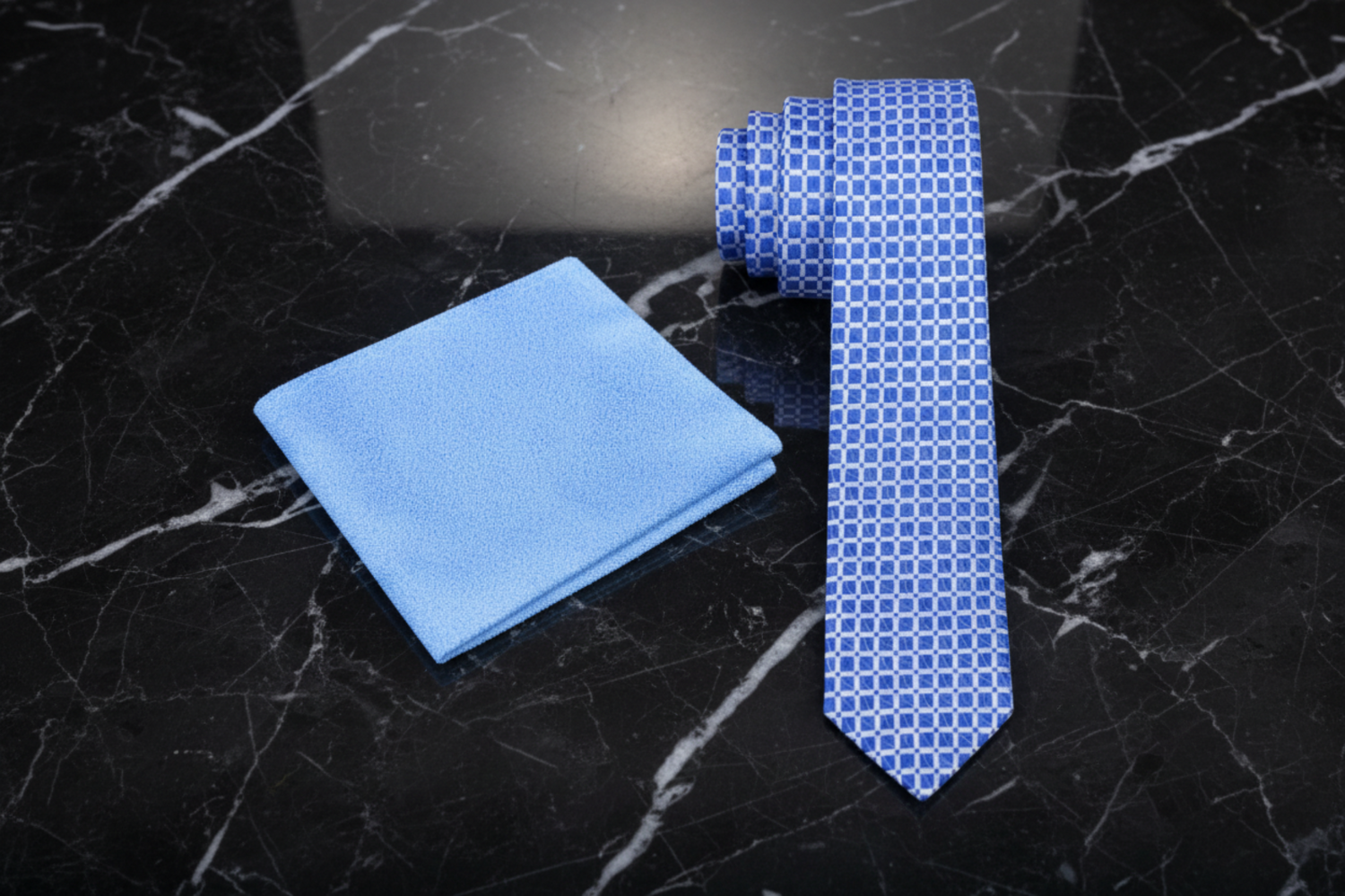 Blue checkered thin tie and light blue pocket square