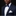 Man wearing a navy suit with a blue polka dot bow tie on a black background