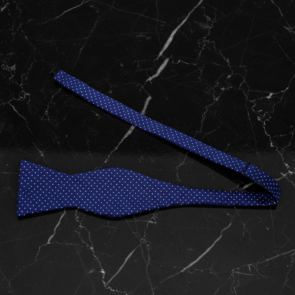 Self Tie: A Blue, White Polka Dot Pattern Self Tie Bow Tie