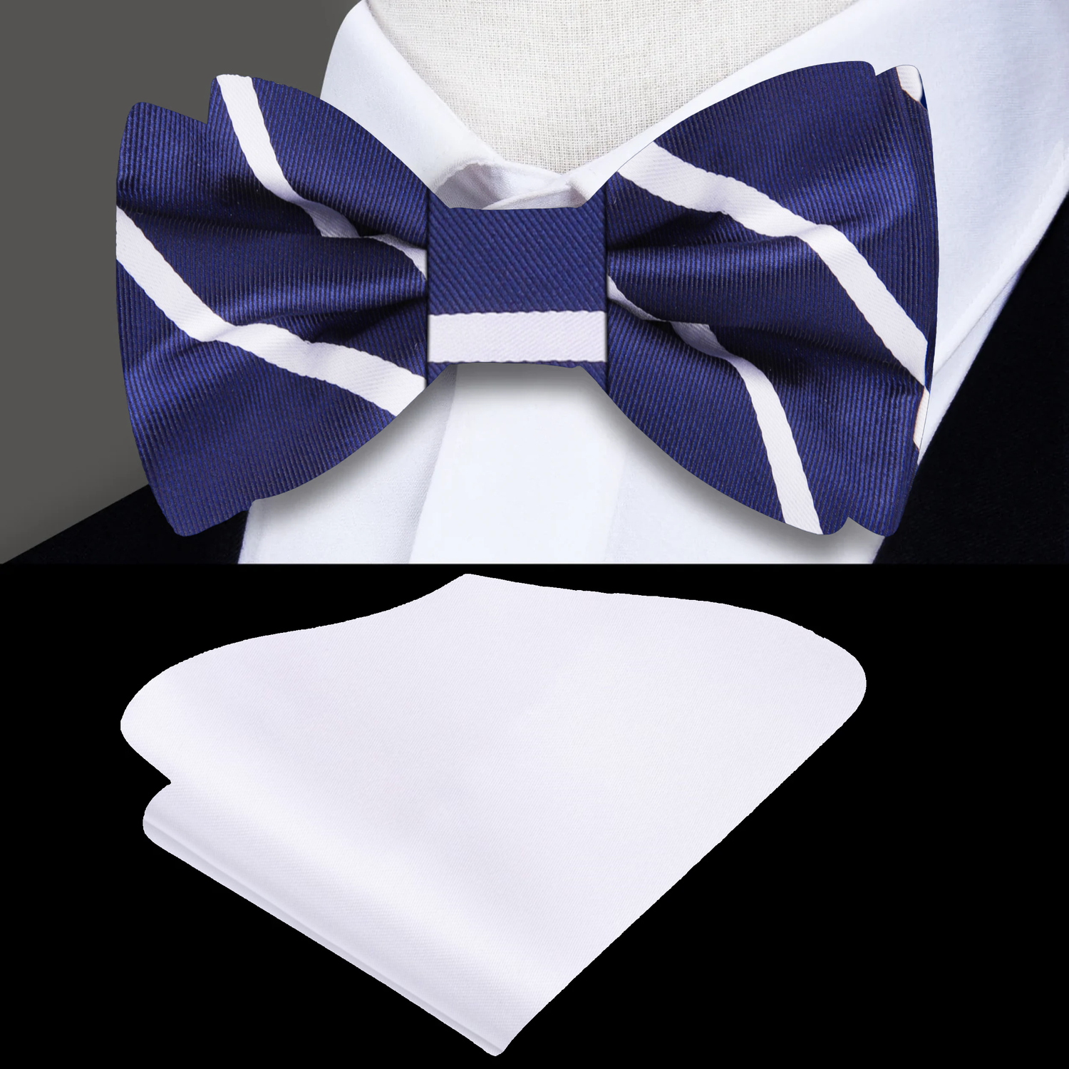 A dark blue bow tie with a white stripe pattern paired with a white pocket square on a white shirt.