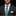 Man wearing a black suit with a white shirt and a blue tie with green floral pattern against a black background