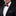 Man wearing a black suit with a colorful bow tie and pocket square on a black background