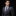 Man wearing blue and gold stripe tie and square 