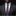 Man wearing a dark suit with a Red and Blue Plaid Tie and Pocket Square