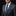 Man wearing a gray suit with a blue striped tie and pocket square on a black background