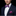 Man wearing blue and pink plaid bow tie and square