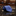Rolled blue tie with small patterns on a dark marble surface