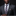 Man wearing a gray suit with a patterned tie and pocket square against a dark background