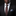 Man wearing a black suit with a patterned tie and pocket square on a dark background