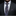 Man wearing a dark suit with a patterned tie and pocket square.