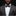 Man wearing a gray suit with a patterned bow tie and pocket square on a black background