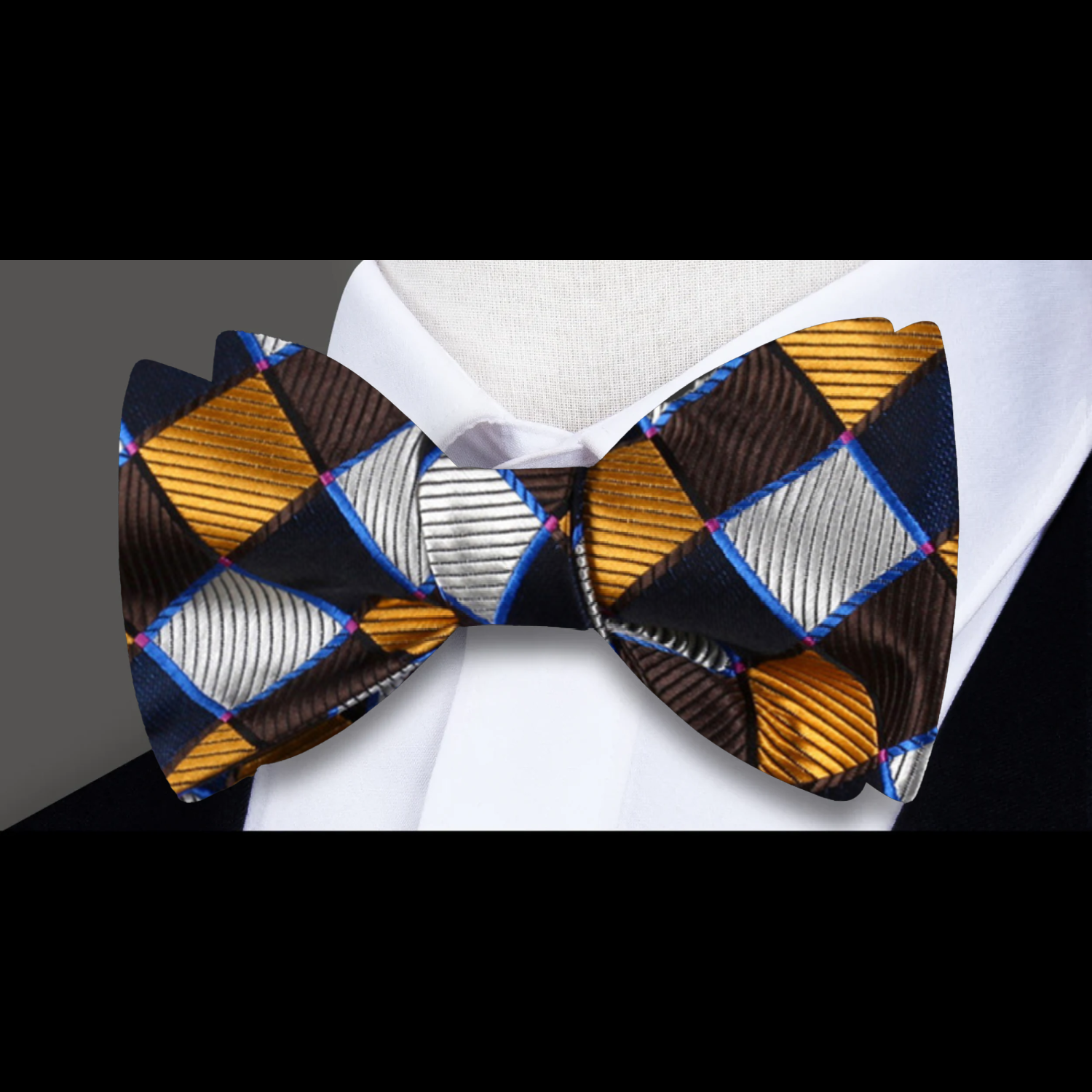 A bow tie with a geometric diamonds pattern in brown, black, and gold colors, displayed on a white background. 