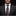 Man wearing a dark suit with a patterned tie and pocket square on a black background