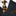 Black suit with a patterned tie and pocket square on a white background