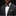 Man wearing a dark gray suit with a brown bow tie and pocket square on a black background