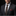 Man wearing a dark suit with a patterned tie and pocket square on a black background