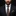 Man wearing a black suit with a patterned tie and pocket square against a dark background
